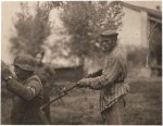 A liberated Jew holds a Nazi at gunpoint.jpg