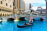 9475237-las-vegas-nevada--july-17-venice-theme-venetian-with-gondola-on-water-and-caesars-casino.jpg